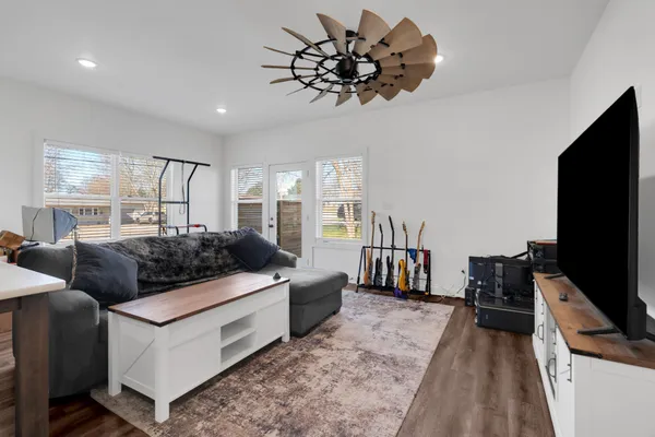 a kitchen with stainless steel appliances a stove refrigerator and a sink