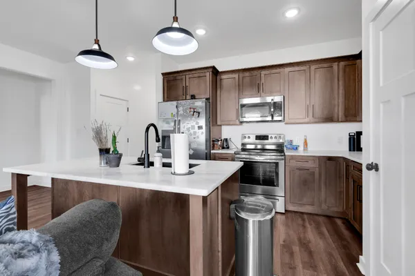 a utility room with cabinets washer and dryer