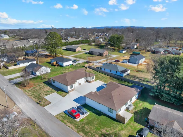 an aerial view of a house with a garden