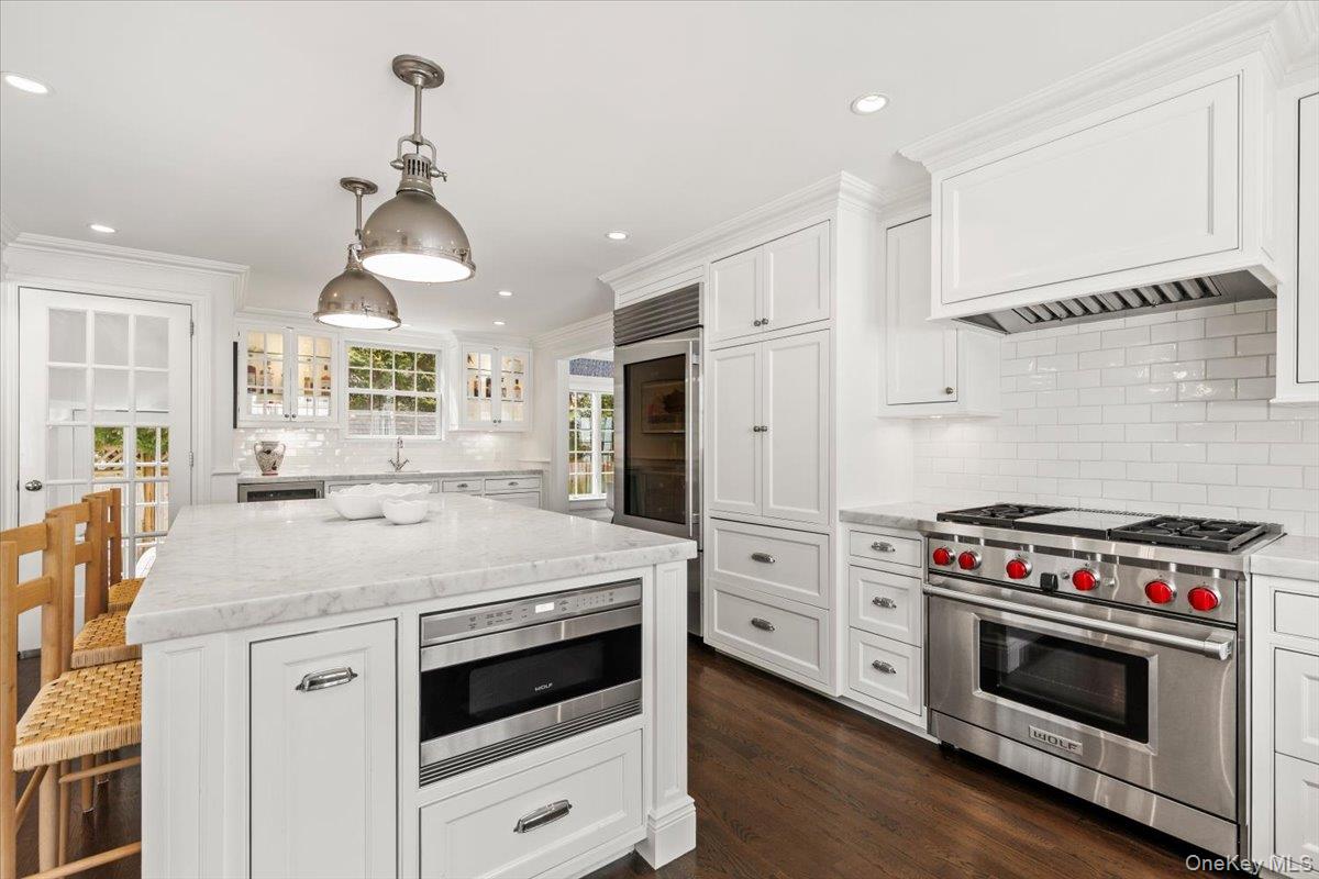 2 Cowles Avenue Rye, NY 10580 - Photo 12 of 35 a kitchen with a stove a sink and a refrigerator
