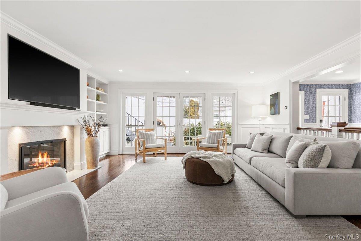 2 Cowles Avenue Rye, NY 10580 - Photo 17 of 35 a living room with furniture fireplace and a flat screen tv