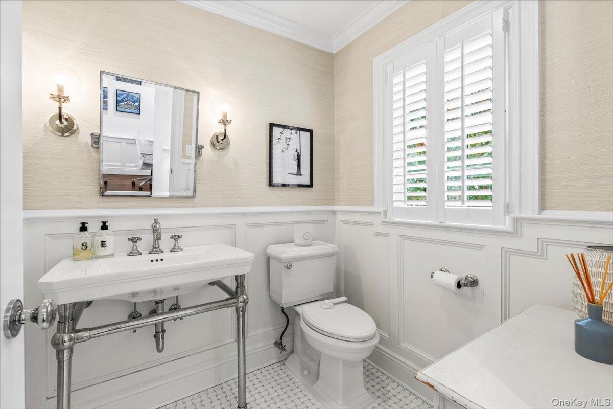 2 Cowles Avenue Rye, NY 10580 - Photo 19 of 35 a bathroom with a sink toilet and mirror
