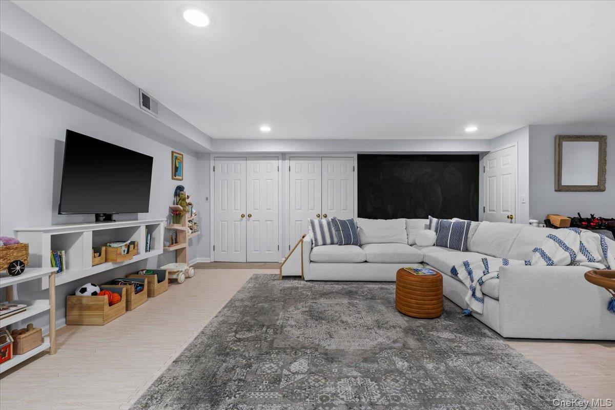 2 Cowles Avenue Rye, NY 10580 - Photo 30 of 35 a living room with furniture and a flat screen tv