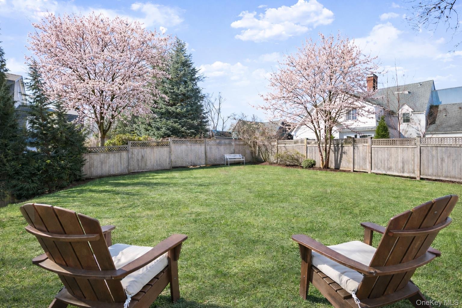 2 Cowles Avenue Rye, NY 10580 - Photo 32 of 35 a backyard of a house with table and chairs