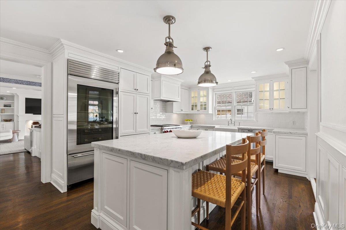 2 Cowles Avenue Rye, NY 10580 - Photo 10 of 35 a kitchen with a table and chairs in it
