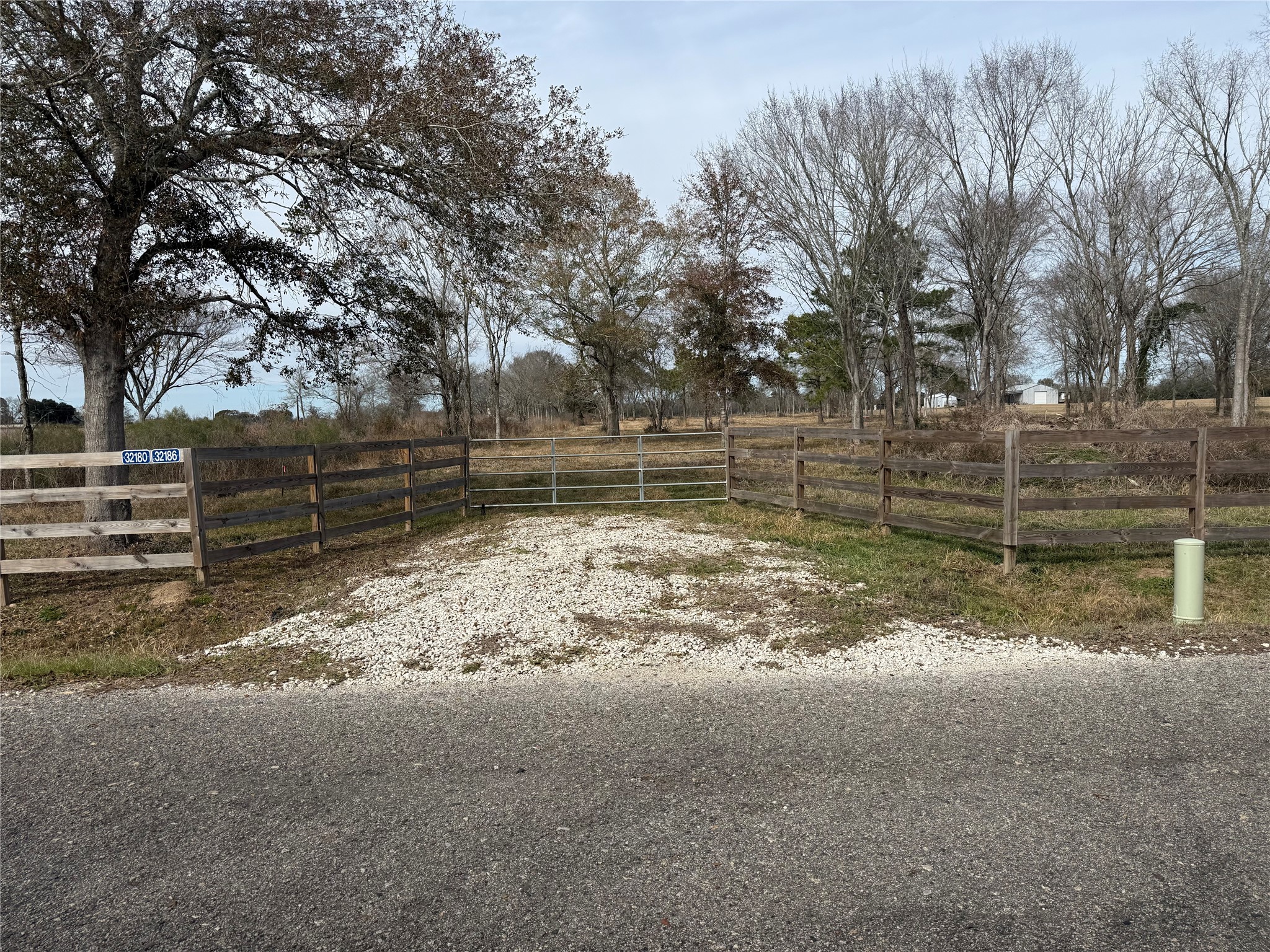 32186 Howell Road Waller, TX 77484 - Photo 6 of 8 a view of a yard with wooden fence