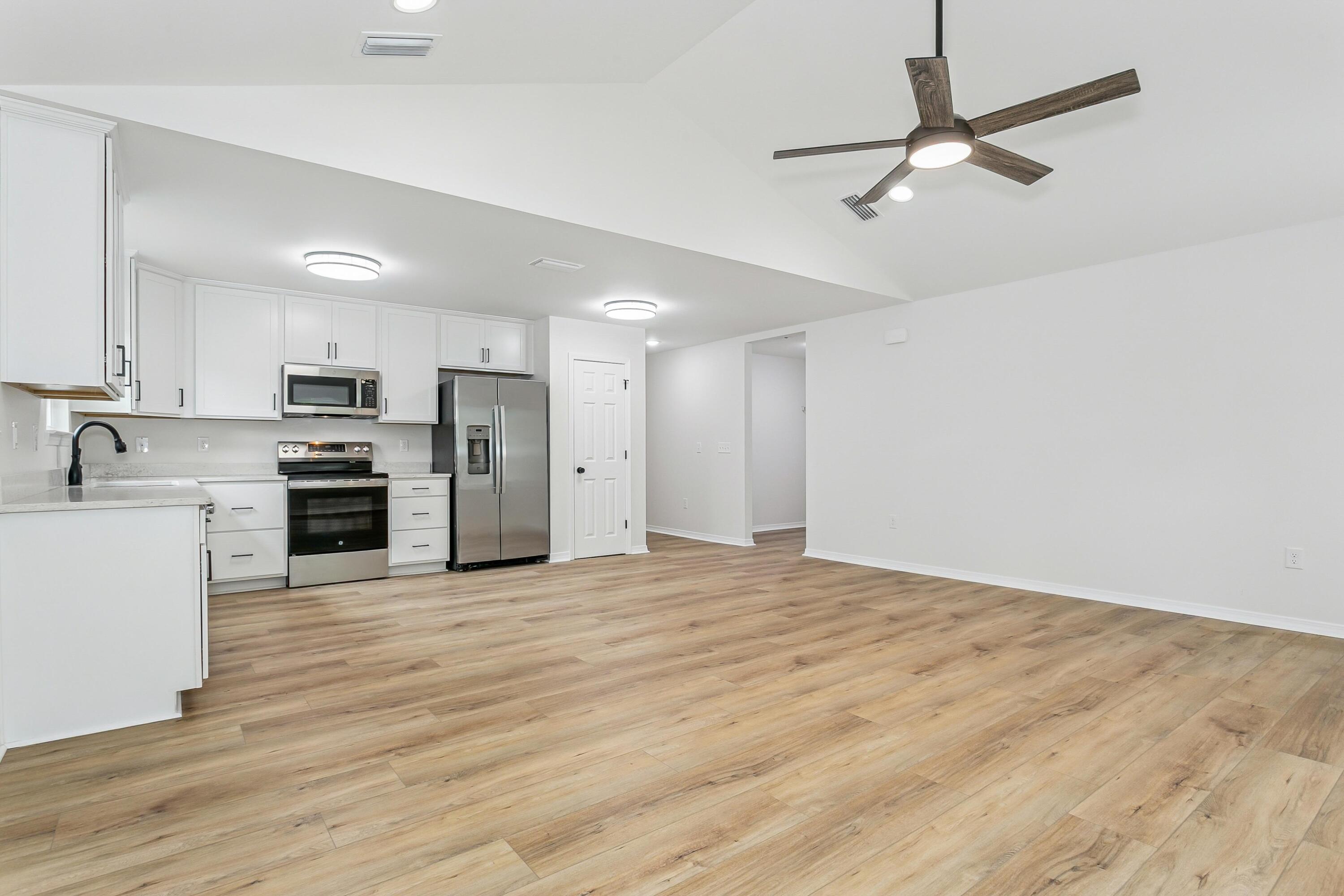 8086 3rd Street Laurel Hill, FL 32567 - Photo 10 of 35 a view of kitchen with microwave and cabinets
