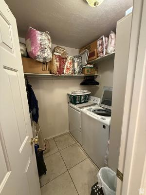641 East Greystone Way Tooele, UT 84074 - Photo 12 of 30 Dedicated laundry area featuring tile flooring and overhead shelving
