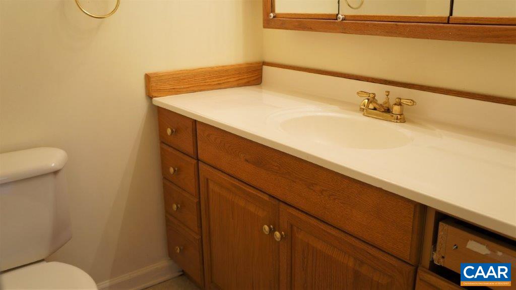 46 Spring Court, Unit 46 Charlottesville, VA 22901 - Photo 18 of 27 a bathroom with a sink and mirror