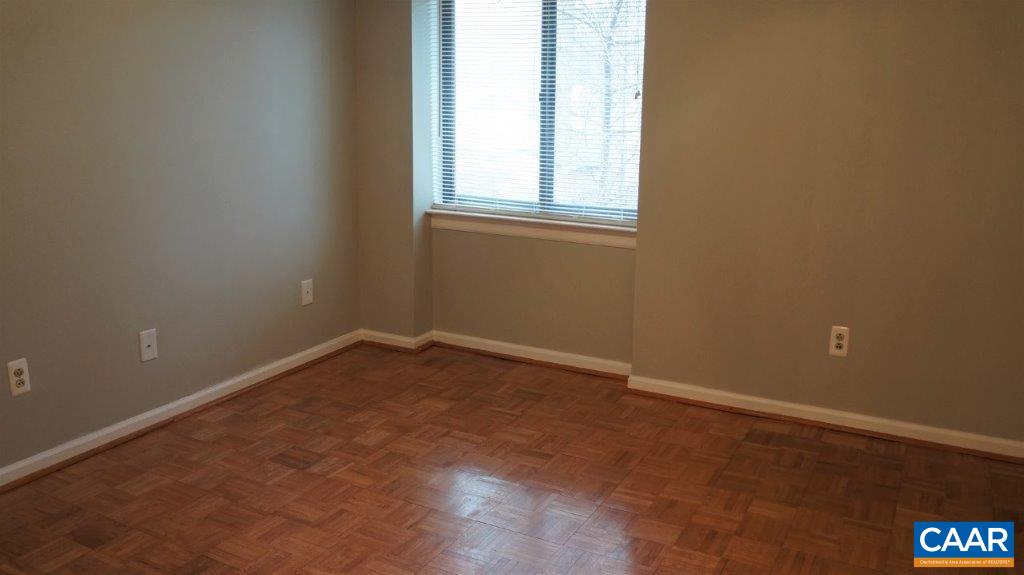 46 Spring Court, Unit 46 Charlottesville, VA 22901 - Photo 23 of 27 an empty room with a window