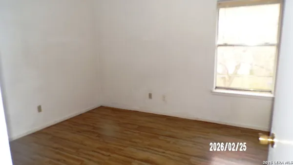 a view of an empty room and window