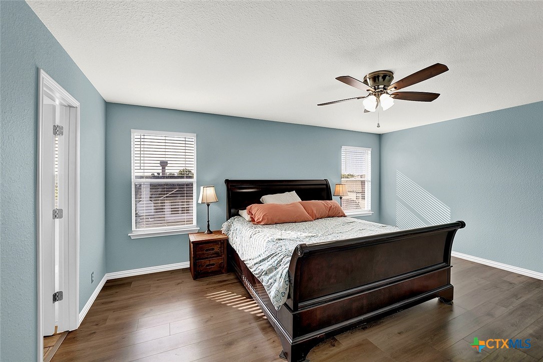 113 Endeavour Kyle, TX 78640 - Photo 18 of 38 a bedroom with a bed ceiling fan and a window