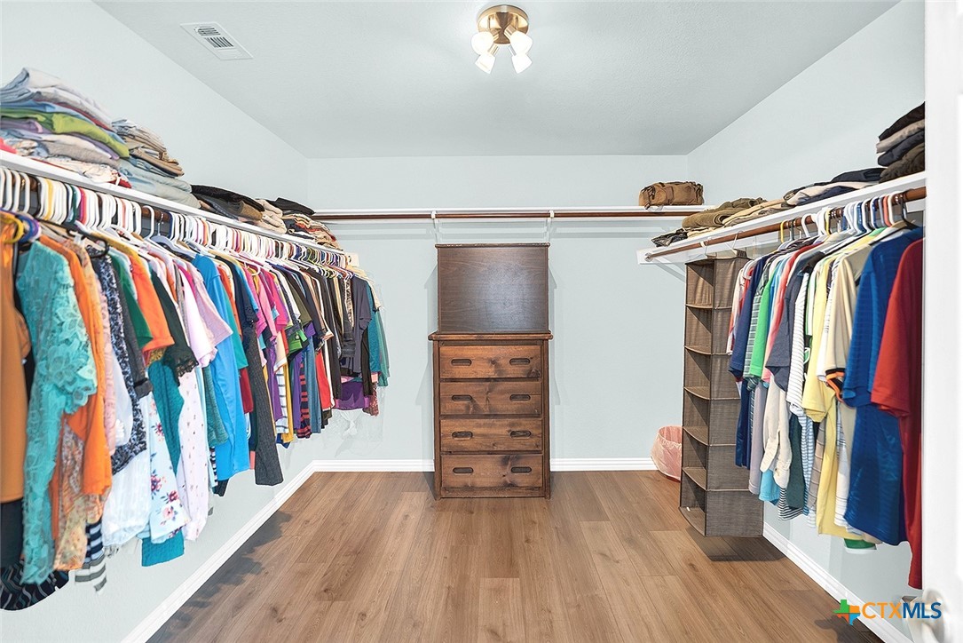 113 Endeavour Kyle, TX 78640 - Photo 19 of 38 a view of walk in closet with clothes and shoes