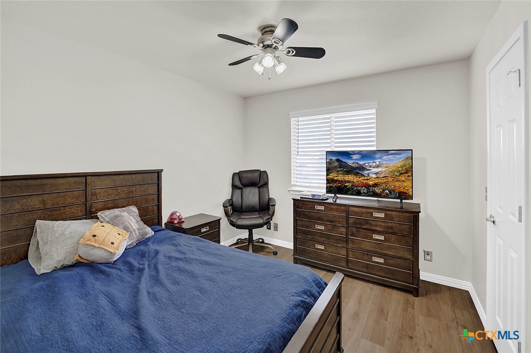 113 Endeavour Kyle, TX 78640 - Photo 23 of 38 a bedroom with furniture and a flat screen tv