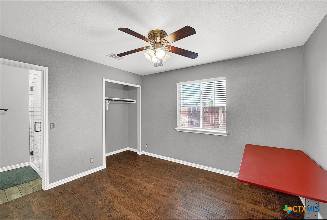 113 Endeavour Kyle, TX 78640 - Photo 28 of 38 a view of an empty room with window and wooden floor