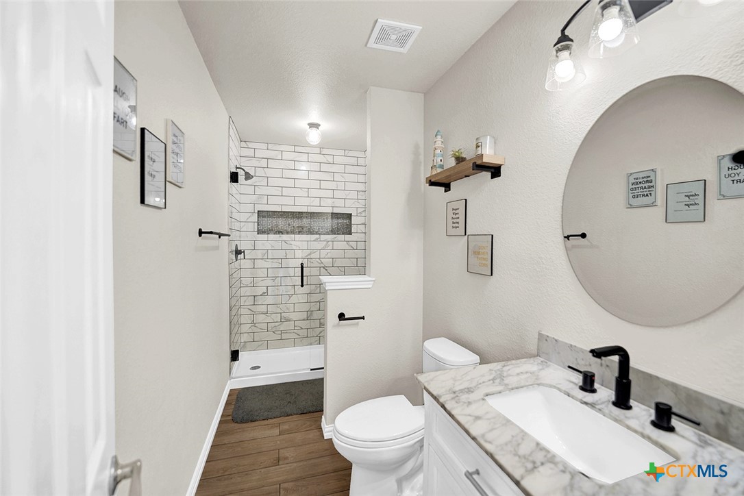 113 Endeavour Kyle, TX 78640 - Photo 29 of 38 a bathroom with a sink a toilet and shower