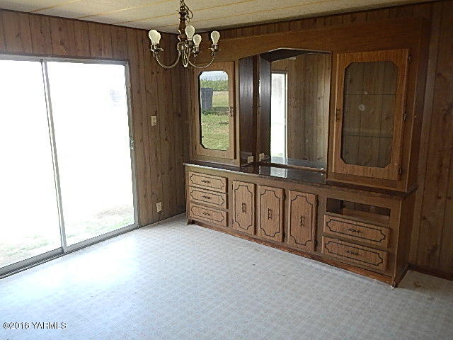 10331 Larue Road Toppenish, WA 98948 - Photo 9 of 13 a view of a room with large windows and cabinet