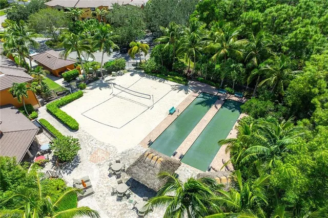 an aerial view of a swimming pool a yard and lake view