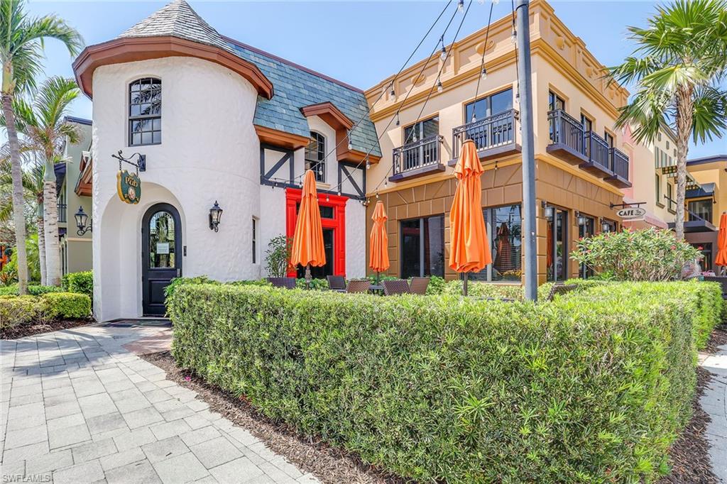 9134 Chula Vista Street, Unit 125 Naples, FL 34113 - Photo 37 of 44 a front view of a multi story residential apartment building