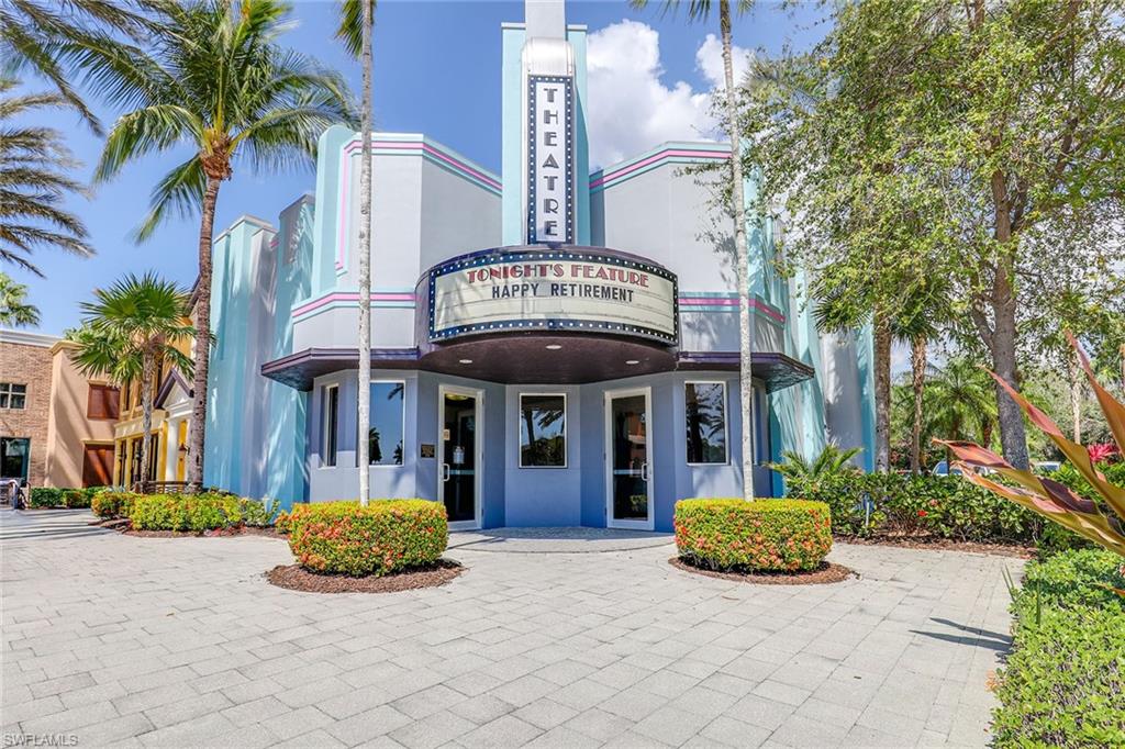 9134 Chula Vista Street, Unit 125 Naples, FL 34113 - Photo 41 of 44 a front view of a building with garden