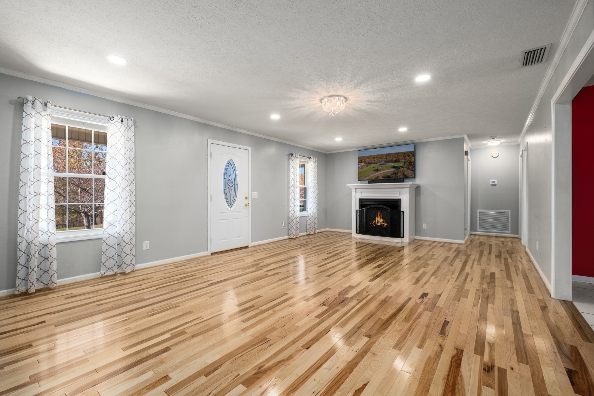 14179 Tucker Ridge Road Silver Point, TN 38582 - Photo 6 of 38 a big room with wooden floor and fireplace