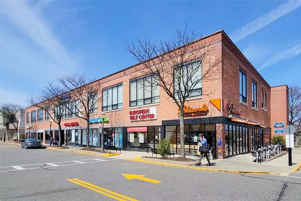 a view of a building along a street