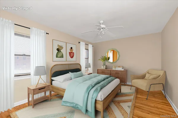 a bedroom with a bed a chandelier and a window