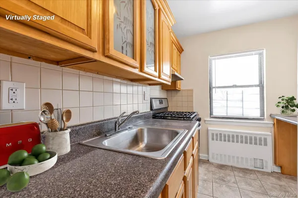 a kitchen that has a sink and a stove