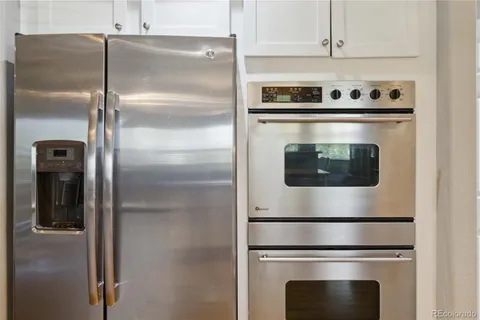 a stove top oven sitting inside of a kitchen