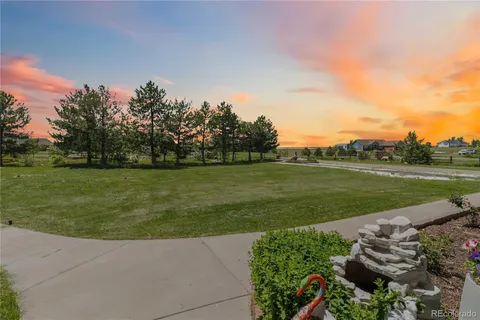 a view of a golf course with a lake
