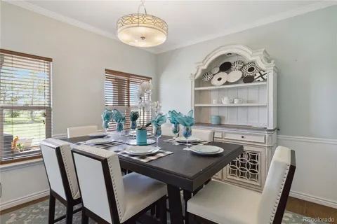 a view of a dining room with furniture window and wooden floor