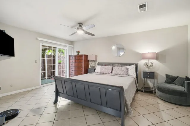 a bed room with a bed and a television