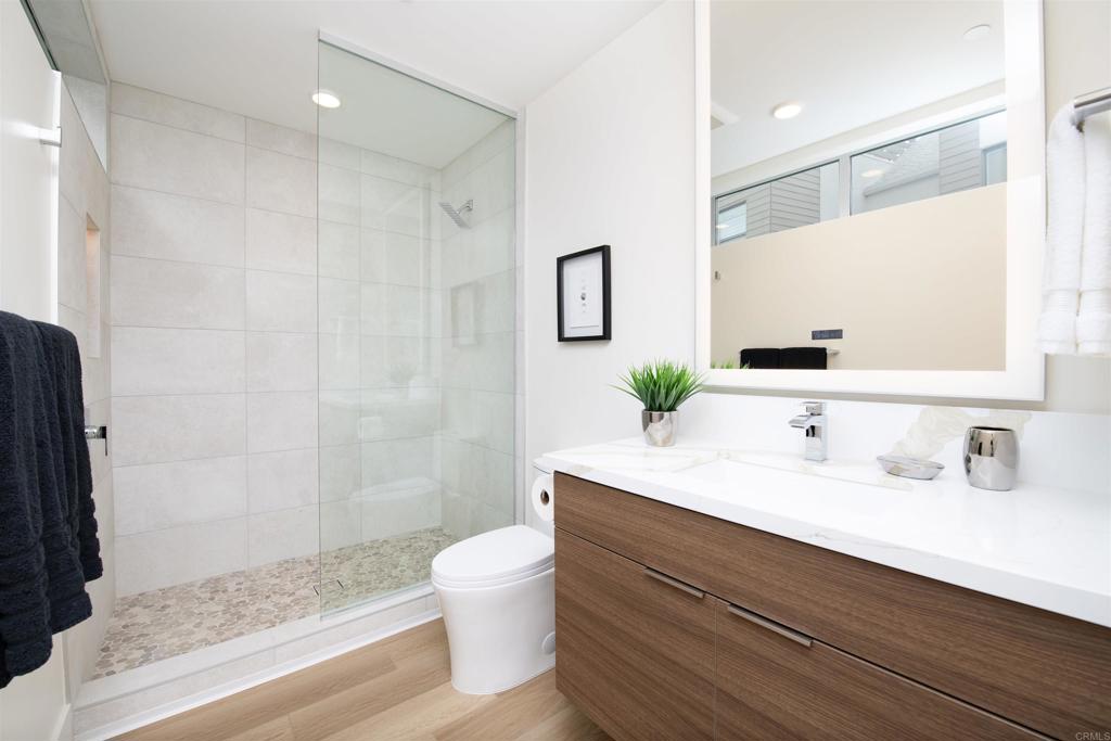 2501 State Street Carlsbad, CA 92008 - Photo 15 of 32 a bathroom with a sink a toilet and shower
