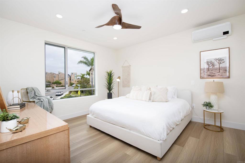 2501 State Street Carlsbad, CA 92008 - Photo 10 of 32 a bedroom with a large bed and a large window