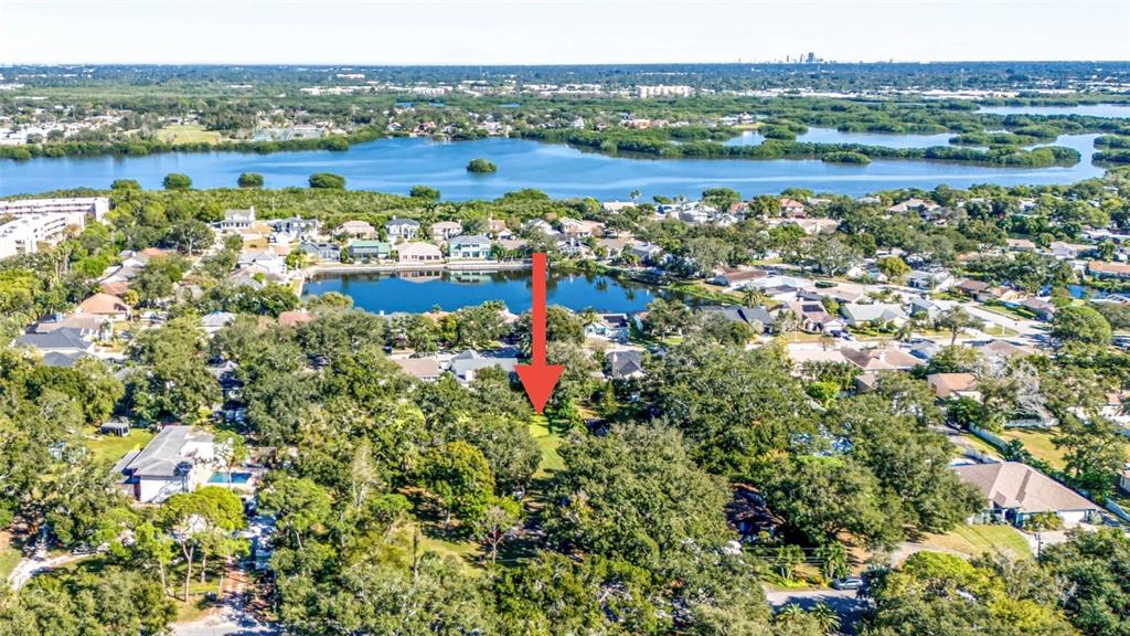 6027 98th Way North St. Petersburg, FL 33708 - Photo 19 of 20 a view of lake with houses