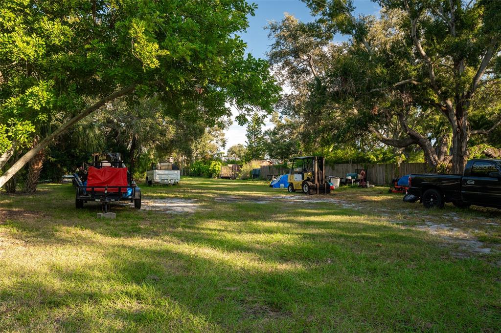 6027 98th Way North St. Petersburg, FL 33708 - Photo 3 of 20 a view of a park with large trees