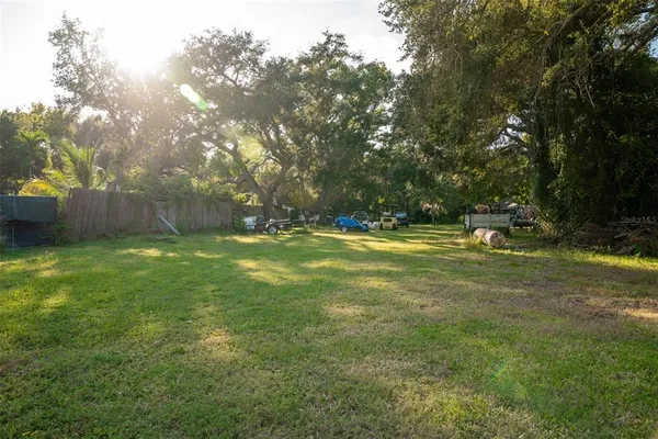 a view of outdoor space with deck and yard