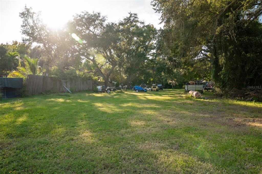 6027 98th Way North St. Petersburg, FL 33708 - Photo 8 of 20 a view of outdoor space with deck and yard