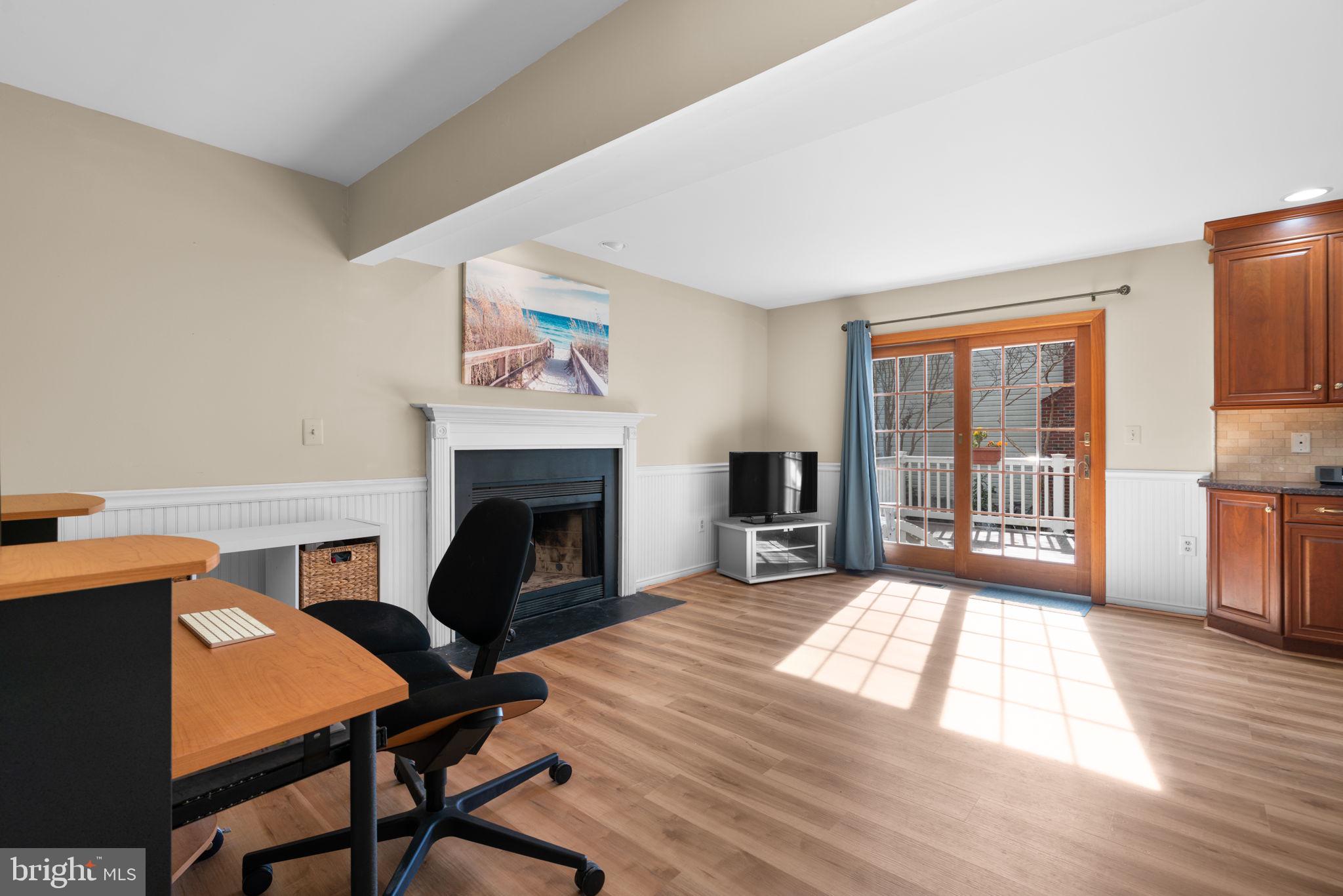 103 Idlewild Road Severna Park, MD 21146 - Photo 12 of 39 a living room with furniture and a fireplace