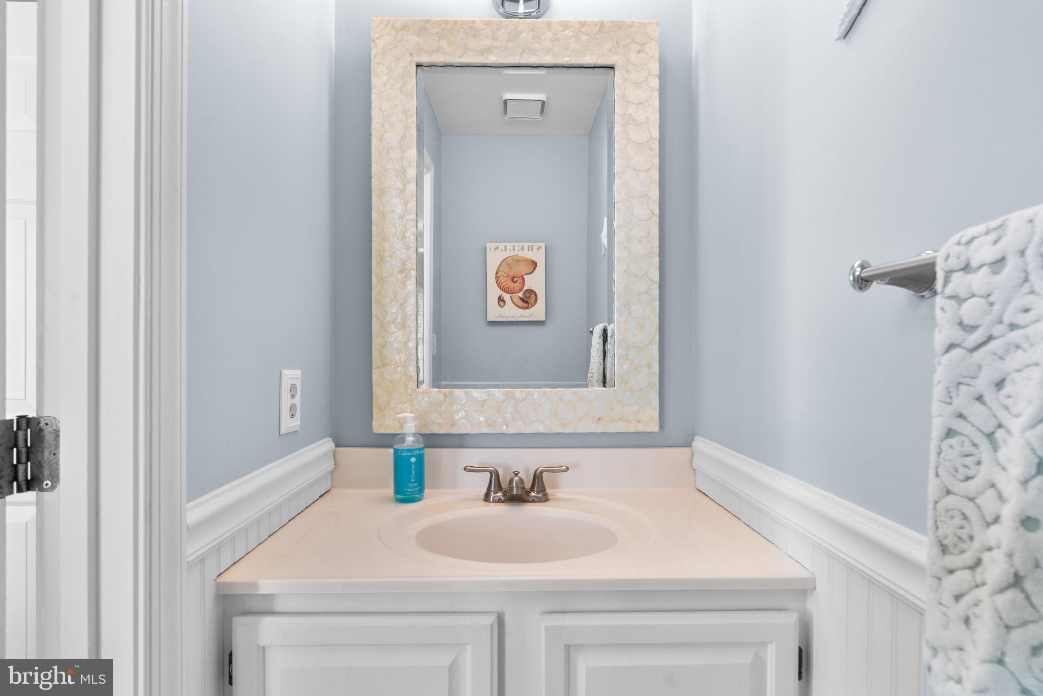 103 Idlewild Road Severna Park, MD 21146 - Photo 16 of 39 a bathroom with a sink and a mirror