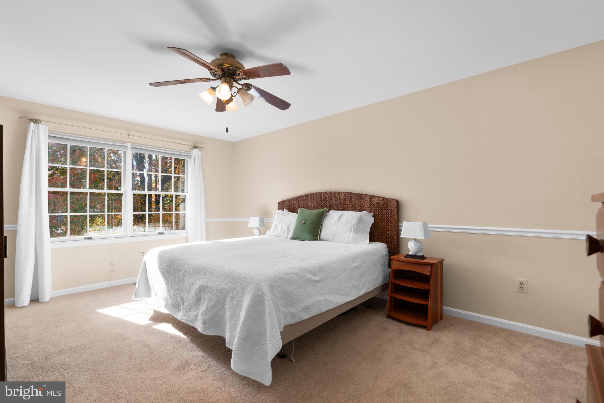 103 Idlewild Road Severna Park, MD 21146 - Photo 18 of 39 a bedroom with a bed and a window