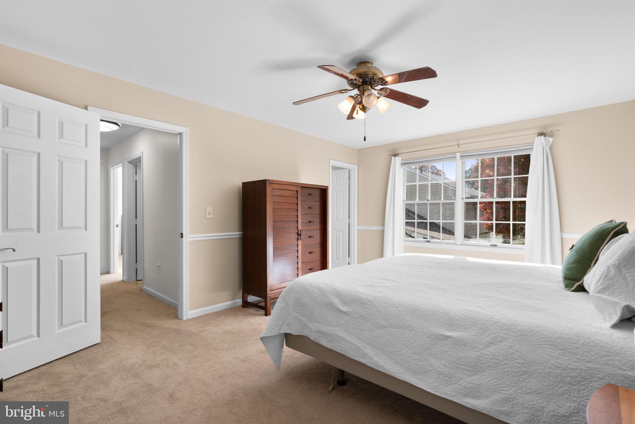 103 Idlewild Road Severna Park, MD 21146 - Photo 19 of 39 a bedroom with a large bed closet and flat screen tv