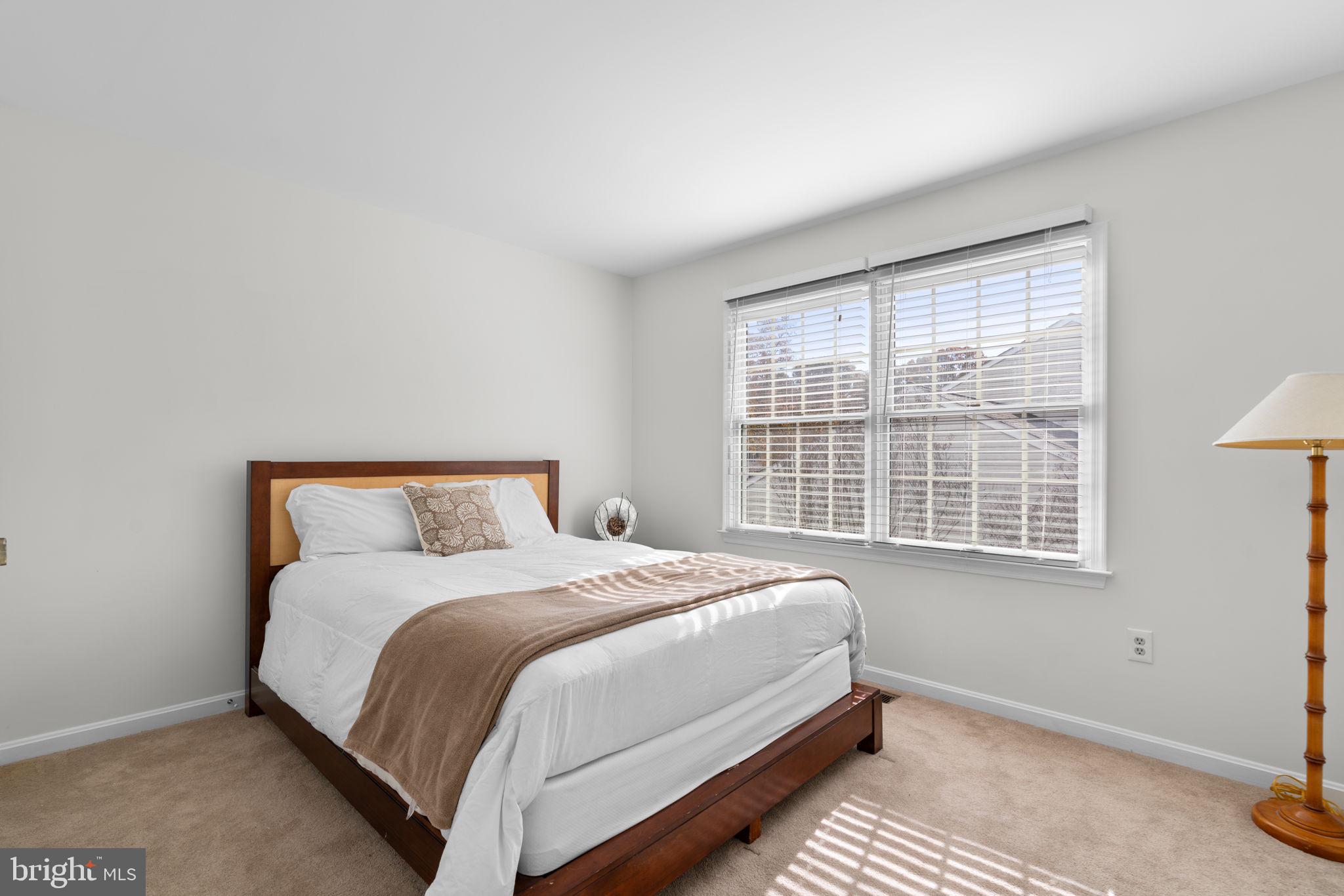 103 Idlewild Road Severna Park, MD 21146 - Photo 24 of 39 a bed sitting in a bedroom next to a window