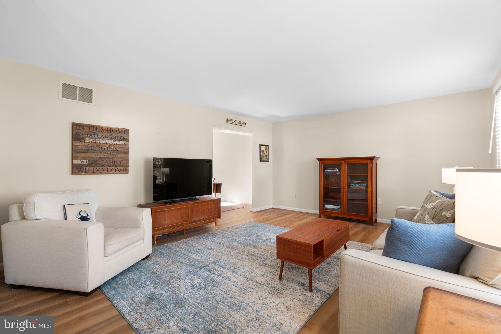103 Idlewild Road Severna Park, MD 21146 - Photo 5 of 39 a living room with furniture and a flat screen tv