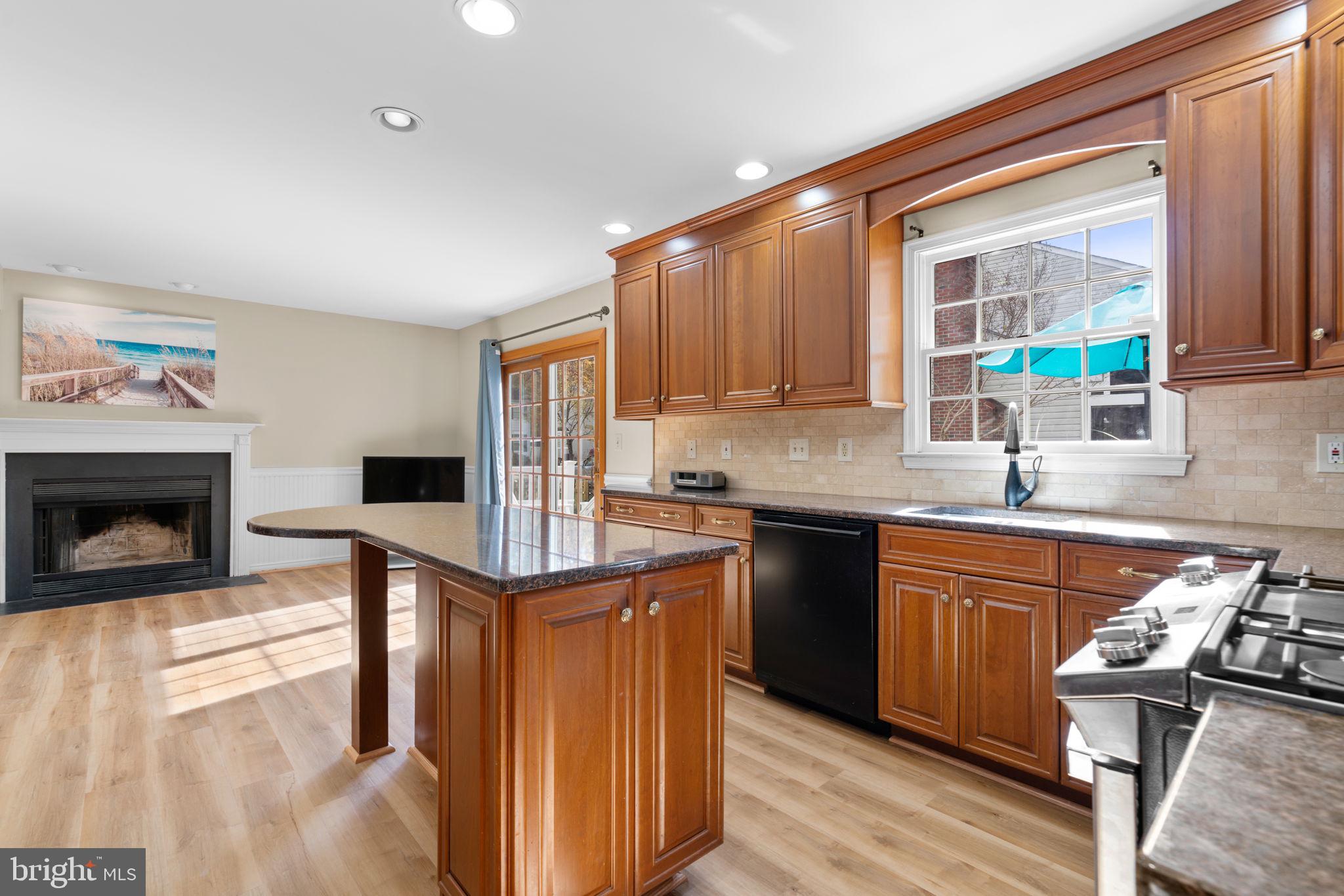 103 Idlewild Road Severna Park, MD 21146 - Photo 10 of 39 a kitchen with stainless steel appliances granite countertop a sink stove and cabinets