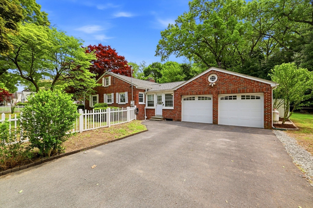 130 Connecticut Avenue Springfield, MA 01107 - Photo 1 of 40 a front view of a house with a yard and garage