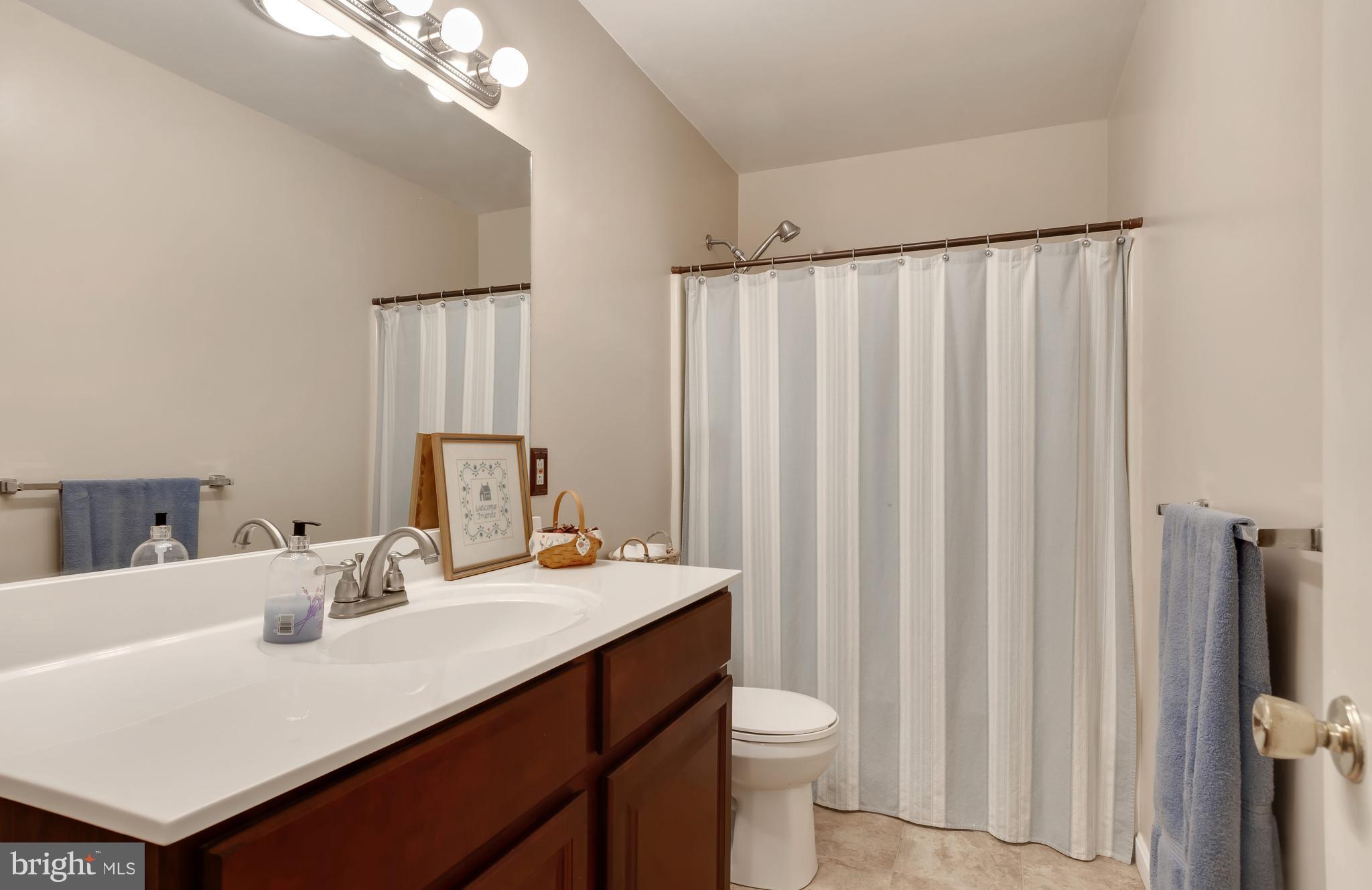 5 Reed Court Chestertown, MD 21620 - Photo 15 of 27 a bathroom with a sink vanity mirror and toilet