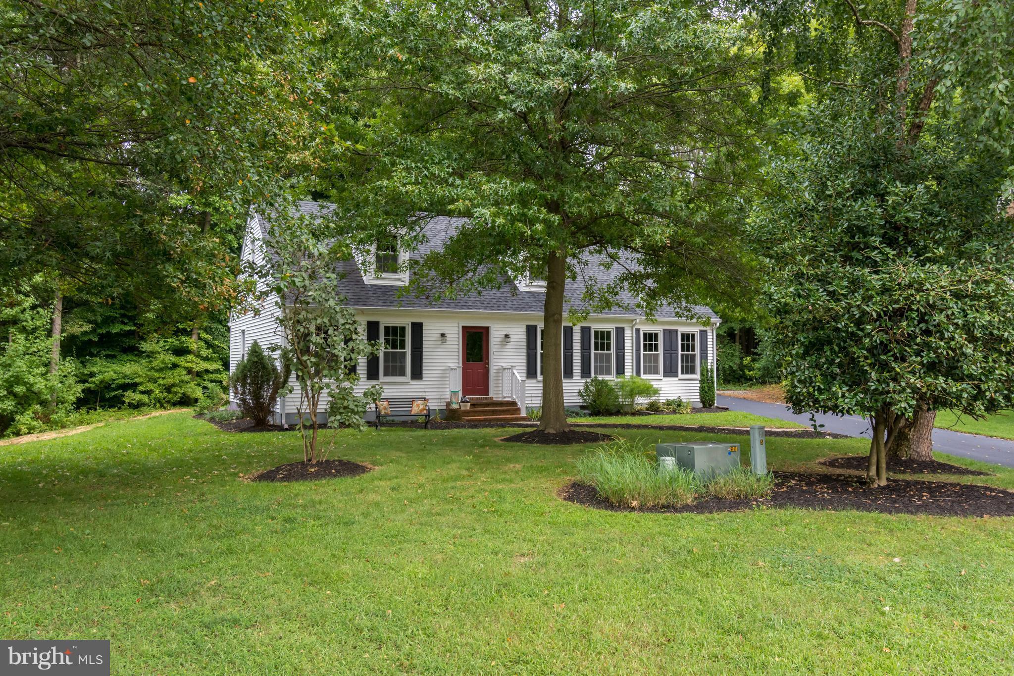 5 Reed Court Chestertown, MD 21620 - Photo 3 of 27 a front view of a house with a garden and trees