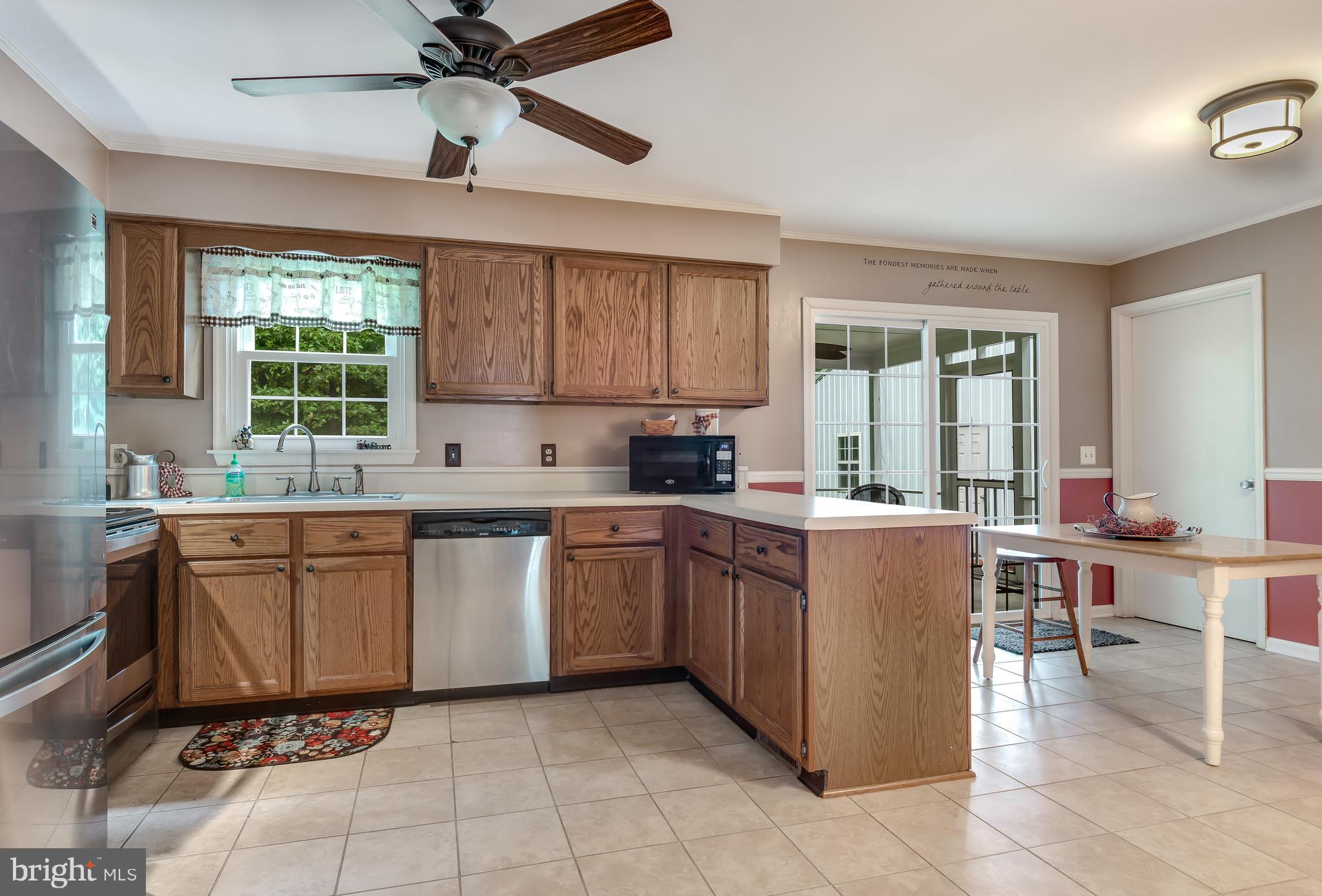 5 Reed Court Chestertown, MD 21620 - Photo 7 of 27 a kitchen with a cabinets counter top space appliances and a window