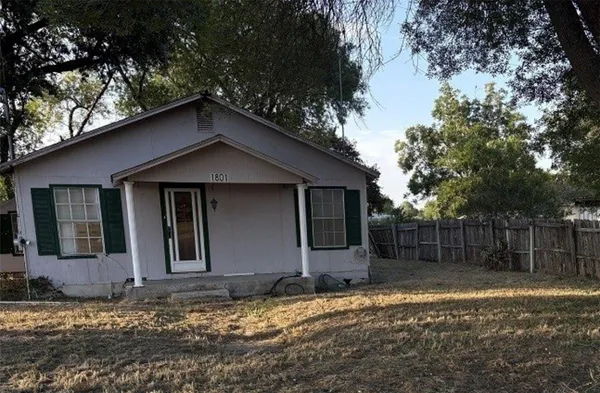 a house with trees in the background